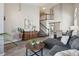 Spacious living room with staircase, hardwood floors, neutral tones and modern furnishings at 1461 Hickory Ct, Erie, CO 80516