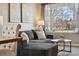 Bright living room with plush seating and a view of the outside through a large window at 1461 Hickory Ct, Erie, CO 80516