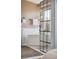 Stylish main bathroom featuring soaking tub with matte black hardware and glass-enclosed walk-in shower at 1461 Hickory Ct, Erie, CO 80516