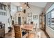 Dining room with wooden floors next to the foyer and near the entryway at 8208 Tabor Ct, Arvada, CO 80005