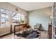 Bright home office with hardwood floors and great light from large windows at 8208 Tabor Ct, Arvada, CO 80005
