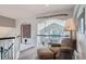 Loft area with seating, neutral color palette, carpeted floor, and natural light at 8208 Tabor Ct, Arvada, CO 80005