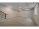 Finished basement featuring carpeted floors, neutral colors, recessed lighting, and a staircase at 2430 Ames St, Edgewater, CO 80214