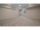 Spacious basement features carpeted floors, multiple outlets, and a window view at 2430 Ames St, Edgewater, CO 80214