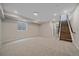 Fully finished basement offers versatile space, recessed lights, and staircase access to upper floors at 2430 Ames St, Edgewater, CO 80214