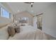 Cozy bedroom with ensuite bathroom access and vaulted ceilings at 2430 Ames St, Edgewater, CO 80214