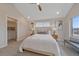 Comfortable bedroom featuring vaulted ceilings and walk-in closet at 2430 Ames St, Edgewater, CO 80214