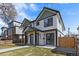 Inviting two-story duplex features a well-kept lawn, modern design, and clearly marked unit numbers at 2430 Ames St, Edgewater, CO 80214