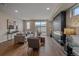 Inviting living room featuring a modern fireplace and stylish decor at 2430 Ames St, Edgewater, CO 80214