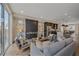 Open concept living room flowing into kitchen with modern finishes at 2430 Ames St, Edgewater, CO 80214