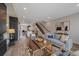 Spacious living room with modern fireplace and open floor plan at 2430 Ames St, Edgewater, CO 80214