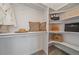 Bright walk-in closet with built-in shelving and plenty of storage for clothes and accessories at 2430 Ames St, Edgewater, CO 80214