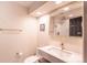 Modern bathroom featuring a floating vanity, gold fixtures, and a glass-enclosed shower at 93 Glenmoor Dr, Englewood, CO 80113
