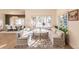Bright breakfast nook with custom wrap-around seating, large windows, and backyard views at 93 Glenmoor Dr, Englewood, CO 80113