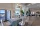 Elegant dining room with large windows, stylish decor, and an open layout, perfect for entertaining guests at 93 Glenmoor Dr, Englewood, CO 80113