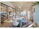 Sophisticated dining area featuring stylish furniture, large windows, and hardwood floors, creating a perfect ambiance at 93 Glenmoor Dr, Englewood, CO 80113