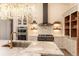 Bright kitchen with stainless steel appliances, marble countertops, and sink at 93 Glenmoor Dr, Englewood, CO 80113