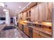 Modern kitchen with stainless steel appliances, granite countertops and wood cabinets at 93 Glenmoor Dr, Englewood, CO 80113