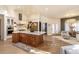Spacious open kitchen with a wooden island and chandeliers at 93 Glenmoor Dr, Englewood, CO 80113