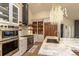 Open kitchen with stainless steel appliances, countertops, and lighting at 93 Glenmoor Dr, Englewood, CO 80113