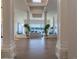 Bright living room featuring large windows, hardwood floors, and elegant architectural columns at 93 Glenmoor Dr, Englewood, CO 80113