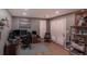 Spacious office with hardwood floors, white shutters, and neutral gray paint at 93 Glenmoor Dr, Englewood, CO 80113