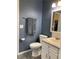 Well-lit bathroom with granite vanity, modern commode and stylish fixtures at 6585 W 84Th Way # 109, Arvada, CO 80003