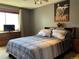 Spacious bedroom with ample natural light, a ceiling fan and custom decor at 6585 W 84Th Way # 109, Arvada, CO 80003