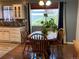 Bright dining area with a wooden table, chairs, and a view of the outdoors at 6585 W 84Th Way # 109, Arvada, CO 80003