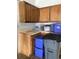 Organized garage storage with upper cabinets and lower containers for efficient space utilization at 6585 W 84Th Way # 109, Arvada, CO 80003