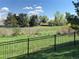 Scenic golf course view with lush green fairway and mature trees, enhancing the property's appeal at 6585 W 84Th Way # 109, Arvada, CO 80003