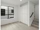 Sunlit bedroom featuring hardwood floors, a large window, and built in storage at 2046 S Holly St # 1, Denver, CO 80222