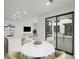 Bright dining space with a view of the outdoor balcony with sliding doors at 2046 S Holly St # 1, Denver, CO 80222