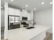 Modern kitchen featuring stainless steel appliances, and white cabinets at 2046 S Holly St # 1, Denver, CO 80222