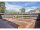 Fenced backyard with mulch landscaping and paver paths at 10711 Longs Way, Parker, CO 80138