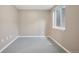 Basement with neutral colored walls and a window for natural light at 10711 Longs Way, Parker, CO 80138
