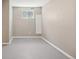 Basement with neutral walls, carpeted flooring and a window for natural light at 10711 Longs Way, Parker, CO 80138