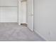 Bedroom featuring neutral walls and carpet, complete with a closet and white trim at 10711 Longs Way, Parker, CO 80138