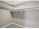 Interior view of a neutral-toned closet with shelves and trim at 10711 Longs Way, Parker, CO 80138