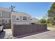 Charming gray home boasts an attached two-car garage and a well-maintained lawn at 10711 Longs Way, Parker, CO 80138