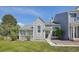 Charming home with distinctive shingle siding, covered porch, and well-manicured lawn at 10711 Longs Way, Parker, CO 80138