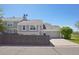 Attractive gray home features an attached two-car garage and a well-maintained lawn at 10711 Longs Way, Parker, CO 80138