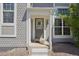 Close-up of the front door with a wreath, showcasing the home's inviting entrance and curb appeal at 10711 Longs Way, Parker, CO 80138