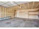 Spacious two-car garage with ample storage space and an interior access door at 10711 Longs Way, Parker, CO 80138