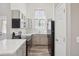 Modern kitchen with stainless steel appliances, sleek countertops, and stylish gray cabinetry at 10711 Longs Way, Parker, CO 80138
