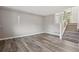 Living room features a staircase and natural light from large windows at 10711 Longs Way, Parker, CO 80138