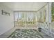 Covered porch with a green rug and sheer white curtains at 10711 Longs Way, Parker, CO 80138