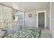 Covered porch with a green rug, sheer white curtains, plants and access door at 10711 Longs Way, Parker, CO 80138