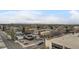 This aerial view showcases the neighborhood with city buildings, roads and light traffic at 2374 S University Blvd # 402, Denver, CO 80210