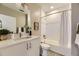 Bathroom with white vanity, undermount sink, and a tub/shower combo at 2374 S University Blvd # 402, Denver, CO 80210
